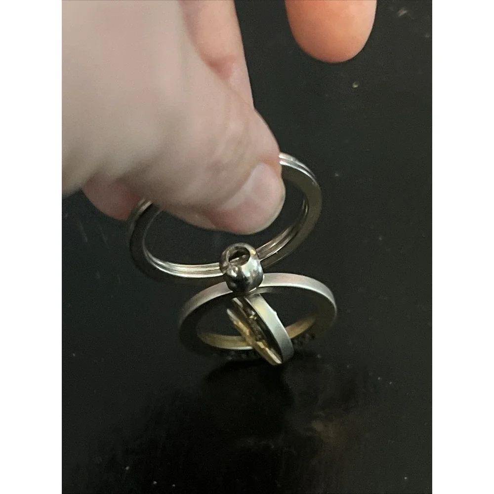 round metal Acapulco‎ souvenir keychain featuring a sailfish design